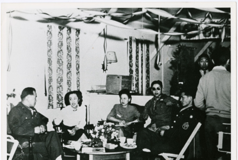 Young women and young men in uniform seated (ddr-densho-122-731)