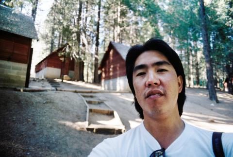 Brad Shirakawa in front of cabins (ddr-densho-336-1936)