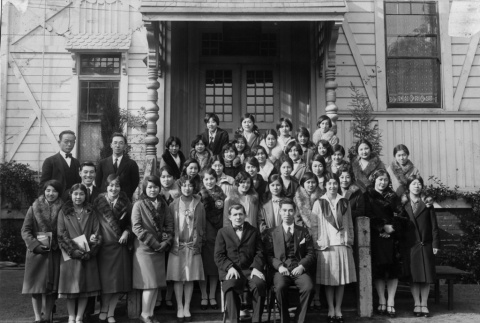 Group of mostly young women posing for photo outside building (ddr-ajah-3-173)