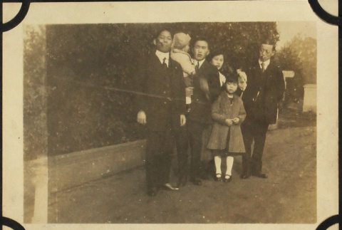 Family picture with three men, one woman and two children (ddr-densho-423-496)