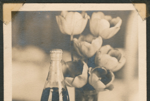 Grape juice with floral arrangement (ddr-densho-433-758)