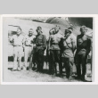 Servicepeople standing front of plane (ddr-densho-1007-177)
