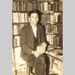Ichiro Numata posing with books (ddr-njpa-4-1532)