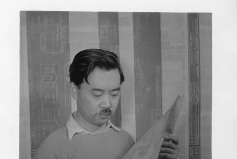George Nakashima looking at plans (ddr-fom-1-883)