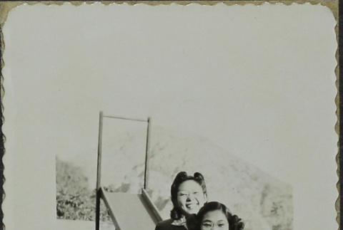 Two women on a slide (ddr-densho-328-558)