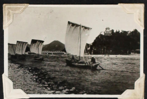 Sailboats near a rocky shore (ddr-densho-404-157)