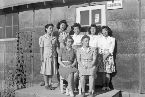 Group of women in front of the Commercial building in Minidoka (ddr-fom-1-614)