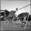Kids on swings in park (ddr-densho-426-959)