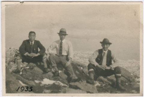 Three men sitting on rocks (ddr-densho-348-88)