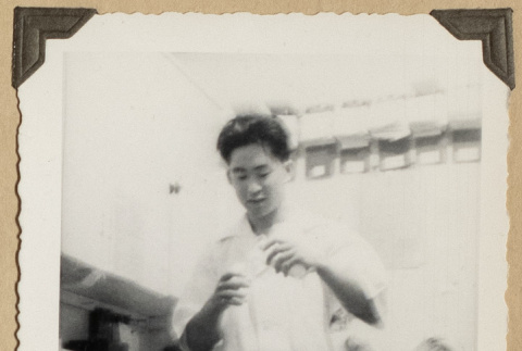 Gary Kikawa mixing at a pharmacy counter (ddr-densho-542-501)