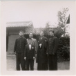 Four men and a boy standing outside house (ddr-densho-426-49)