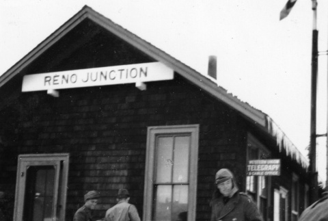 Men outside Reno Junction station (ddr-ajah-2-783)