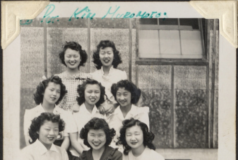 Group of eight women outside barracks (ddr-densho-466-898)