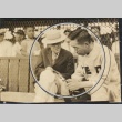 Keio University baseball player talking with a man (ddr-njpa-4-1371)