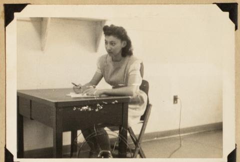 Yuki seated at a desk (ddr-densho-542-536)