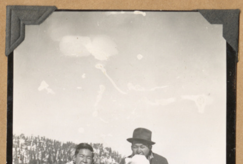 Two men eating snowballs (ddr-densho-542-53)