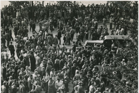 Aerial view of a large crowd gathered in the streets (ddr-densho-299-151)