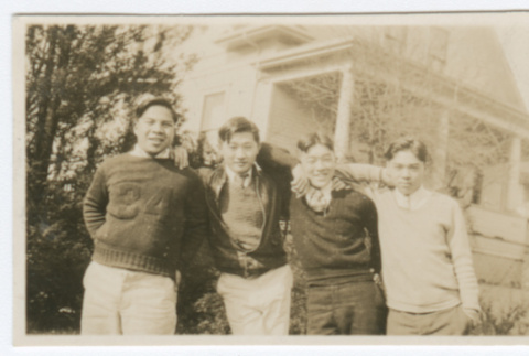 Four young men in front of house (ddr-densho-383-403)