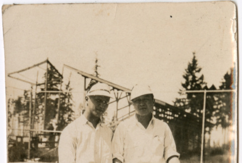 Two men on tennis court (ddr-densho-523-13)