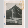 Man standing outside a tent (ddr-densho-463-119)