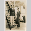 Man and woman on stairway aboard ship (ddr-densho-426-1523)