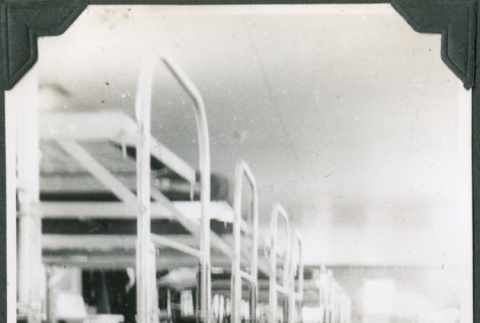 Row of bunk beds in barracks (ddr-ajah-2-383)