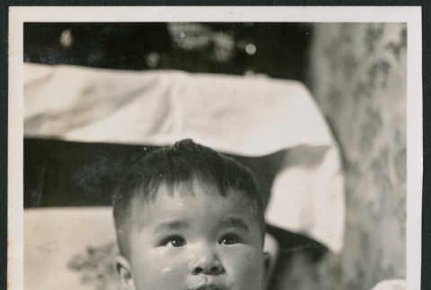 Photo of baby in a high chair (ddr-densho-483-729)