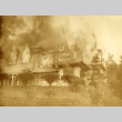 Two photographs of Yukio Ozaki and his house on fire (ddr-njpa-4-1238)