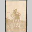 Man and woman in swimwear standing on shore (ddr-densho-523-24)