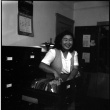 Woman seated by file cabinet (ddr-densho-426-952)