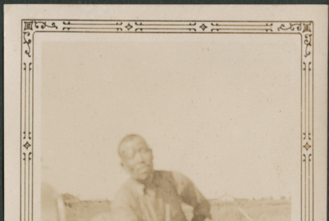 Man leaning on car (ddr-densho-316-265)
