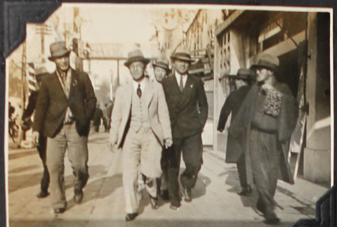 4 men walking on street (ddr-densho-326-367)