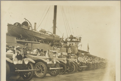Cars parked on a dock next to the Yakumo (ddr-njpa-13-1166)