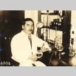 Seiji Onishi, an engineer posing with research equipment (ddr-njpa-4-1526)