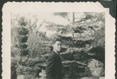 Masao Sakagami in a garden (ddr-densho-328-315)