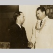 Jack Dempsey shaking hands with a man (ddr-njpa-1-163)