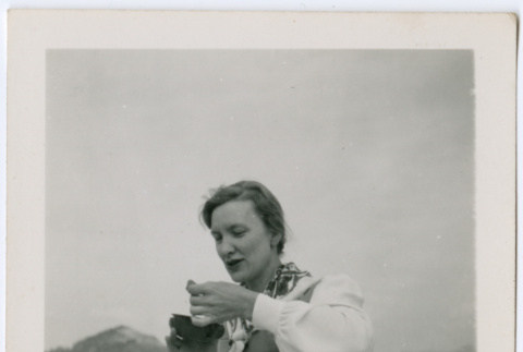 Woman eating in the mountains (ddr-densho-329-768)