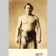 Sumo wrestler posing in mawashi (ddr-njpa-4-1381)