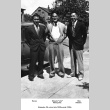 Three men standing on sidewalk (ddr-ajah-6-107)