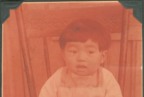 Child sitting on chair (ddr-densho-316-376)
