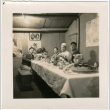 Four men seated at banquet table, one man in chef's hat (ddr-densho-426-1400)