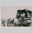 Group of women in back of truck  with other agricultural workers (ddr-densho-560-26)