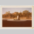 Circular driveway with rock garden in center (ddr-densho-377-2168)
