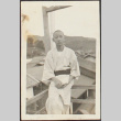 A teenage boy posing on a deck (ddr-densho-278-57)