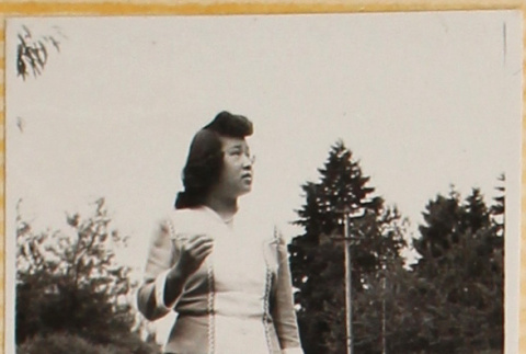 Woman standing on gravel driveway (ddr-densho-522-21)