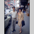 Martha (Nozawa) Tsuchida and unknown man standing by car (ddr-densho-426-749)