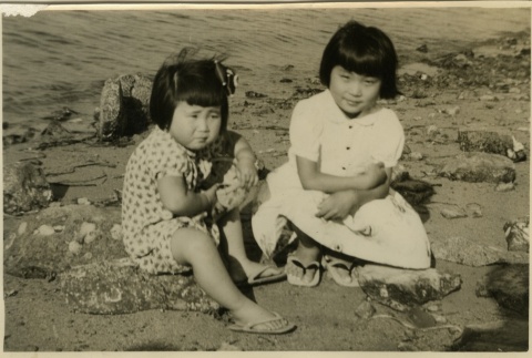 Two sisters on a beach (ddr-densho-113-15)