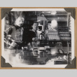 Gary Kikawa inside The Owl Drug Co. (ddr-densho-542-60)