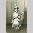 Girl in costume holding flower (ddr-densho-430-221)