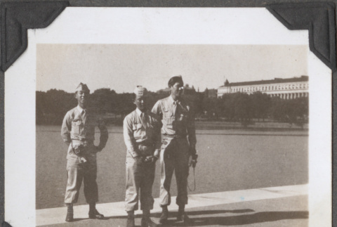 Three men in uniform by pond (ddr-densho-466-184)